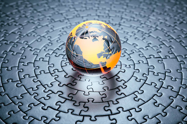 стеклянный глобус на круговой головоломке - transparent puzzle glass jigsaw puzzle стоковые фото и изображения