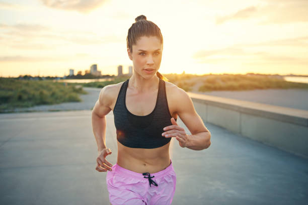 istock Attractive fit young woman jogger 603285020
