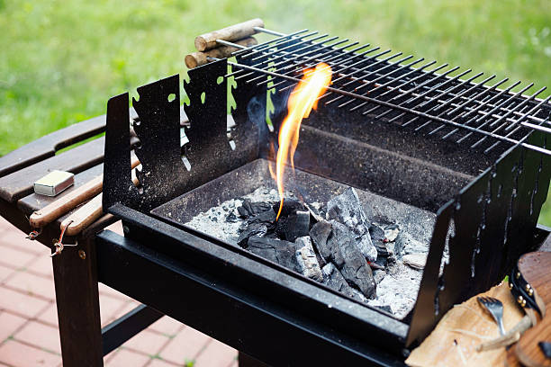istock Preparing charcoal grill for a summer barbecue party. 603285186