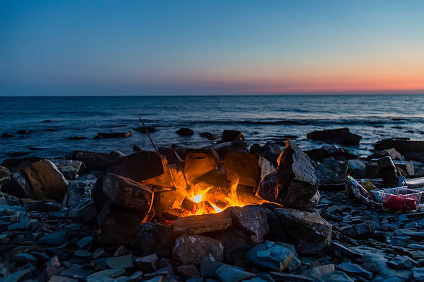 istock Fire by the sea with sunset. Amazing place 603285392