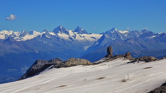 Glacier de Diablerets and Quille du Diable, famous rock. Distant view of the Matterhorn and other high mountains in Switzerland.