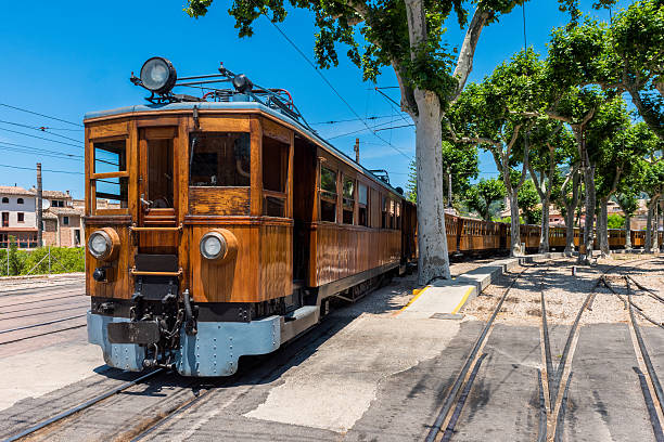 Train on Station in Soller Mallorca Historic electric train at Soller Trainstation, Mallorca, Balearic Islands, Spain. It operates between capital Palma de Mallorca and Soller and is an important tourist attraction nowadays. palma majorca stock pictures, royalty-free photos & images