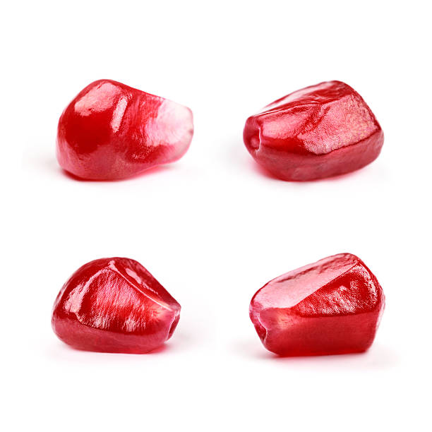 istock Four perfect pomegranate seeds, isolated 603305294