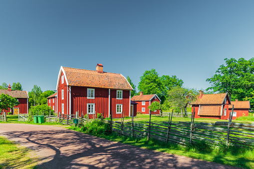 Historic village with ancient red wooden houses in Sweden