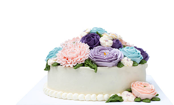 istock Birthday cake with colorful flowers isolated 603312732