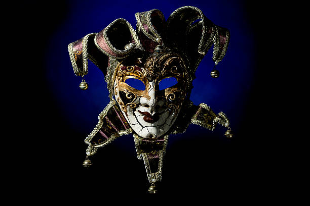 istock Beautiful venetian souvenir mask on black with blue light 603312906
