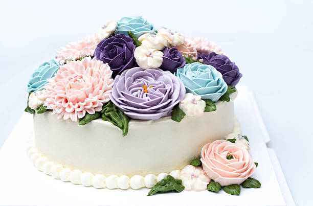 istock Birthday cake with colorful flowers isolated 603313086