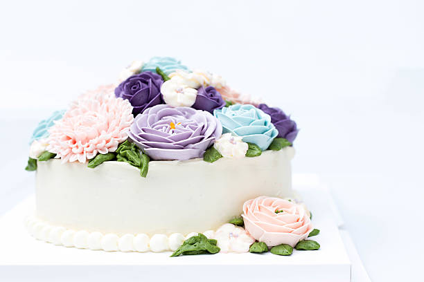 istock Birthday cake with colorful flowers isolated 603313500