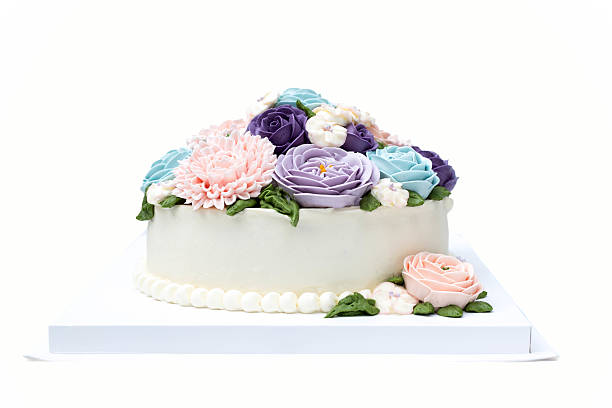 istock Birthday cake with colorful flowers isolated 603313534