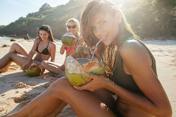 istock Group of young people enjoying summer vacation on beach 603314528