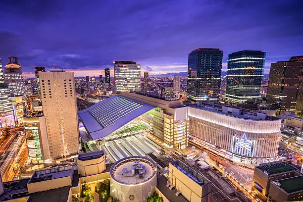 Osaka, Japan skyline over the station.