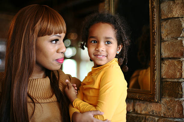 istock African mother and daughter. 603316228