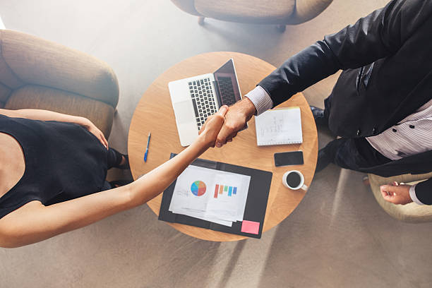 istock Businesspeople shaking hands after a successful meeting 603316546
