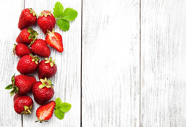 istock ripe strawberries on wooden table 603316910