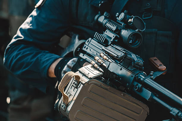 istock Soldier with a machine gun in his hands. 603319526