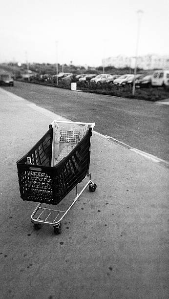 istock Abandoned Shopping Cart On Sidewalk Against Sky 603735943