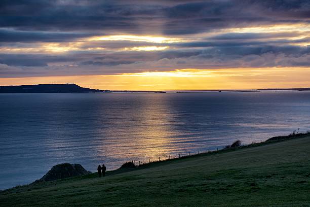 istock Scenic View Of Sea Against Cloudy Sky During Sunset 603765789
