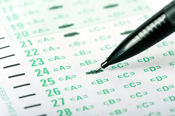 An answer sheet or optical mark recognition sheet with a mechanical pencil.