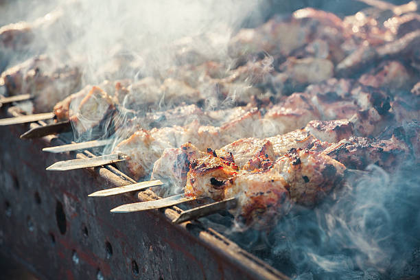 istock Marinated, diced pork meat fried on a grill. 603830518