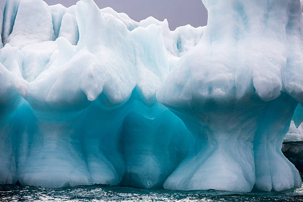 istock Iceberg with reflection drifting in the arctic ozean 603830866