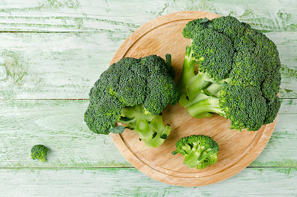 Broccoli rich in vitamins and minerals Broccoli rich in vitamins and minerals. Dietary product for the prevention of various diseases broccoli stock pictures, royalty-free photos & images