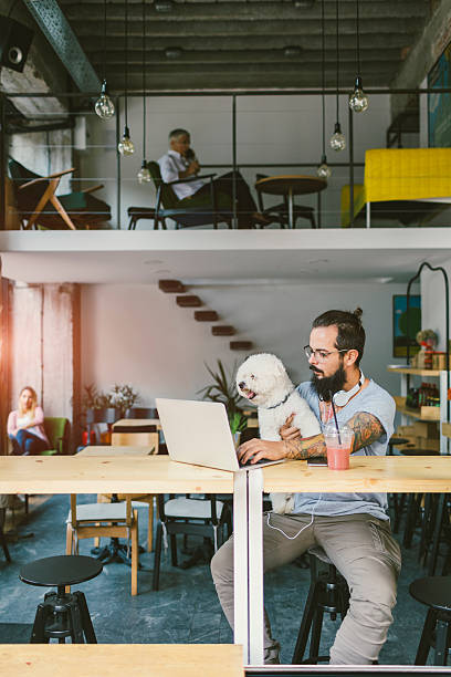 istock Beard Man Sitting In Cafe With His Dog 603844044