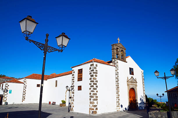 Street with old church in Vilaflor mountain village in Tenerife. Beautiful street with old church in Vilaflor mountain village in Tenerife,Canary Islands,Spain. village vilaflor on tenerife stock pictures, royalty-free photos & images