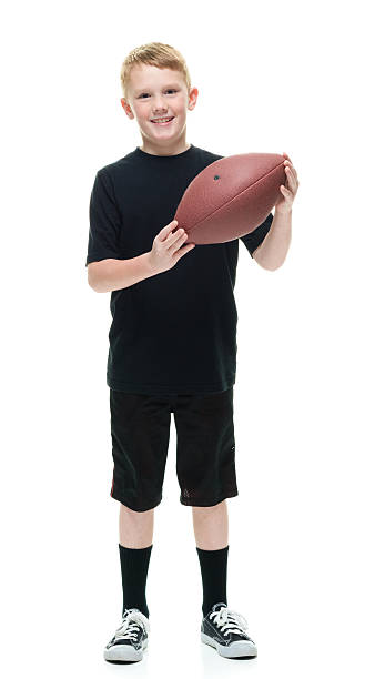 istock Smiling little boy holding American ball 603849902