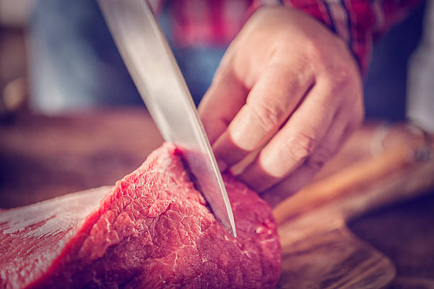 istock Cutting Fresh Meat to Ground it in a Mincer 603851178