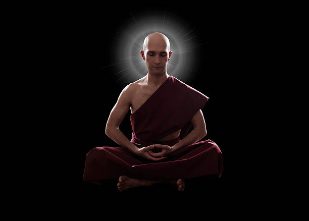 istock buddhist monk in meditation pose over black background 603851476