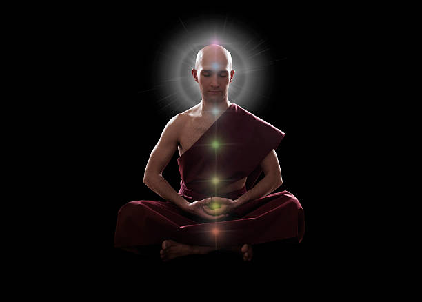 istock buddhist monk in meditation  pose with colorful Chakras 603851708