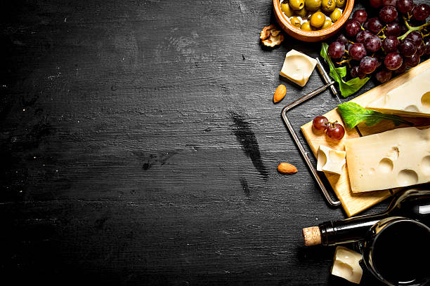 istock Red wine with fragrant cheese , olives and almonds. 603851724