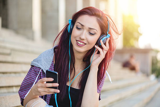 istock Young girl surfing the net on smartphone 603852164
