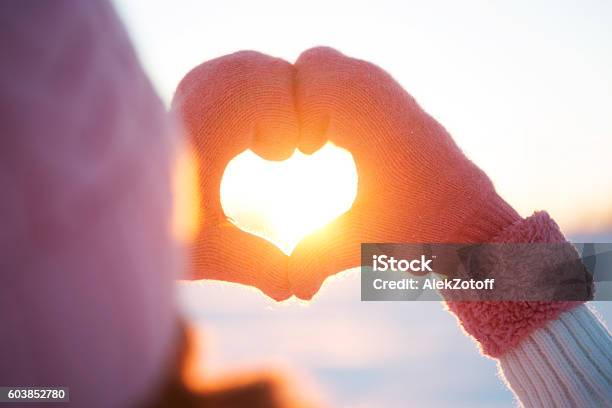Woman Hands In Winter Gloves Heart Symbol Stock Photo - Download Image Now - Winter, Heart Shape, Sun