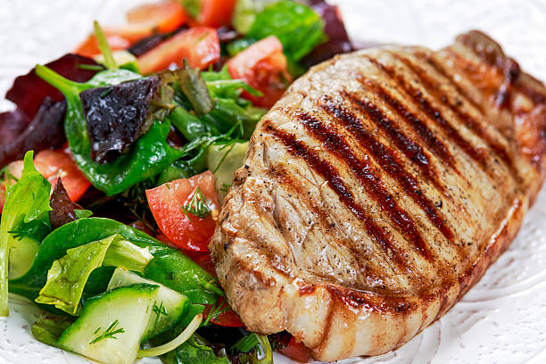 istock Grilled pork meat and vegetables on plate 603853672