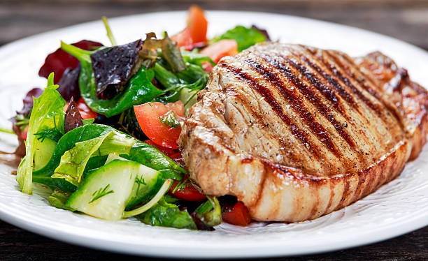 istock Grilled pork meat and vegetables on plate 603853794