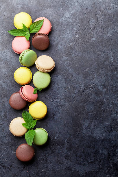 istock Colorful macaroons on stone table. Sweet macarons 603855162