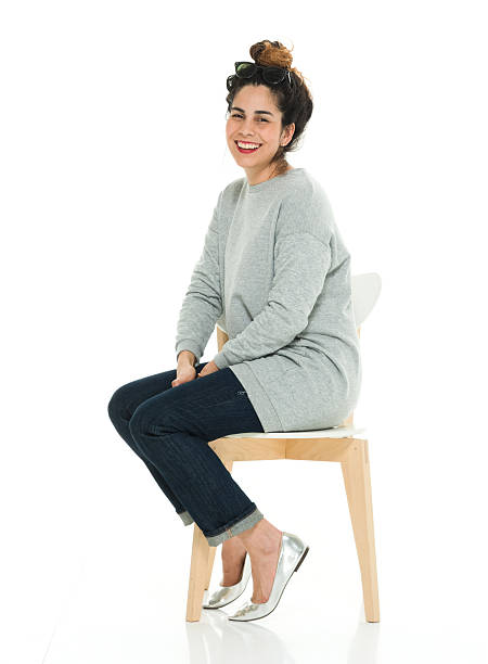 istock Cheerful woman sitting on chair 603855384