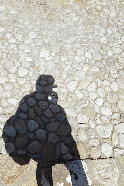 istock shadow of a man on the ground 603855412