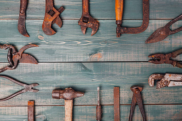 istock different rusty construction instruments on the green wooden background 603856148