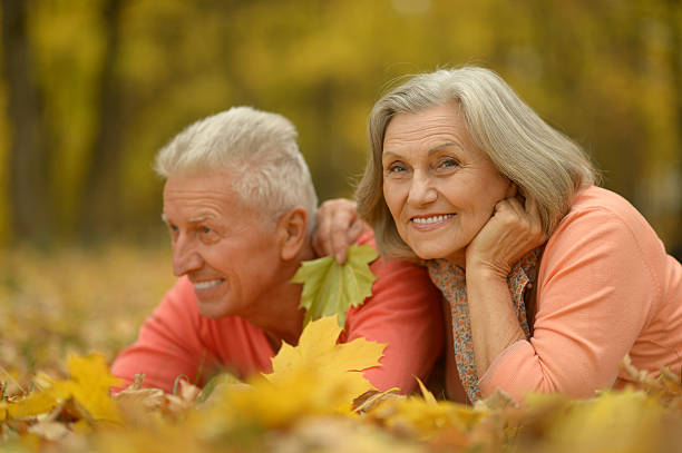 istock Senior couple in autumn park 603856214