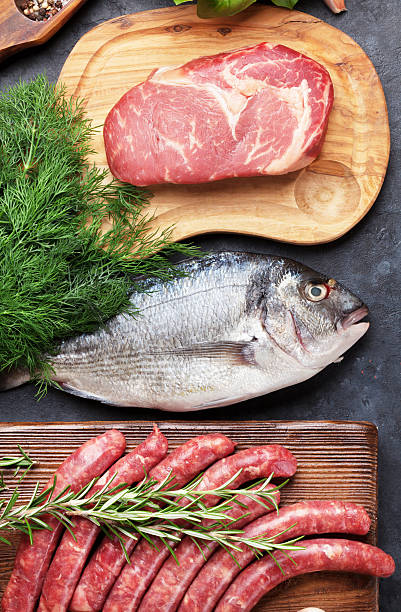 istock Sausages, fish and meat cooking 603857058