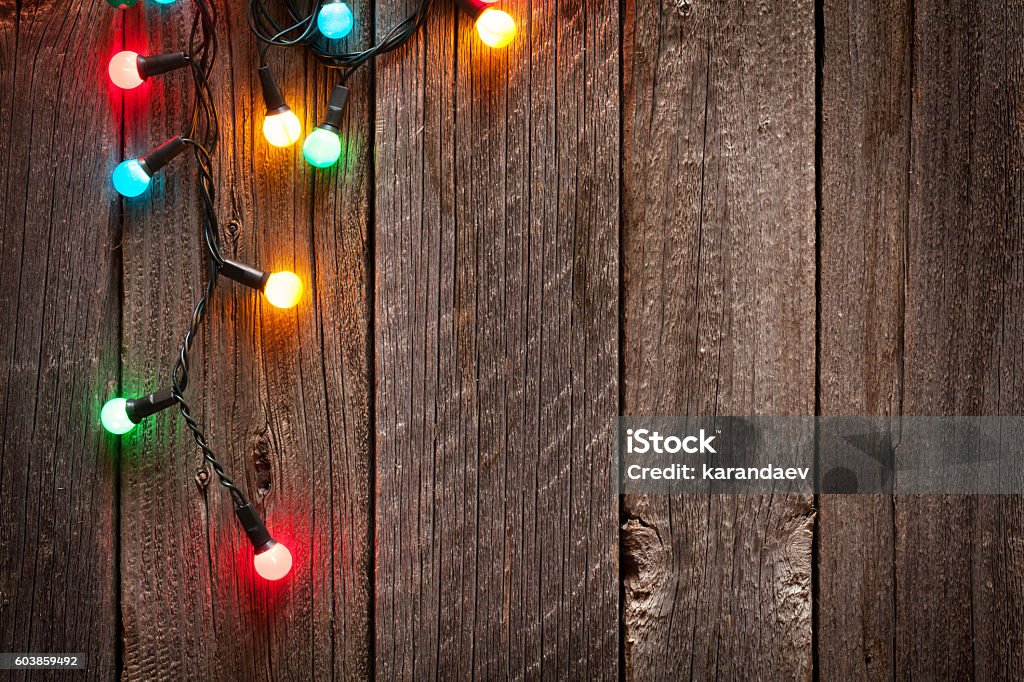 Christmas colorful lights Christmas colorful lights on wooden table with copy space Christmas Lights Stock Photo