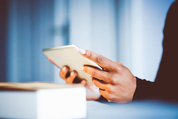 istock Woman using digital tablet, close up of hands 603860480