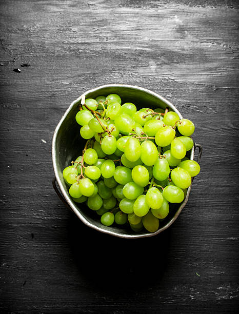istock White grapes in the old pot. 603860490