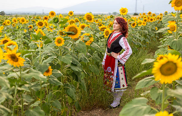 istock Girl in a sunflower field 603861312