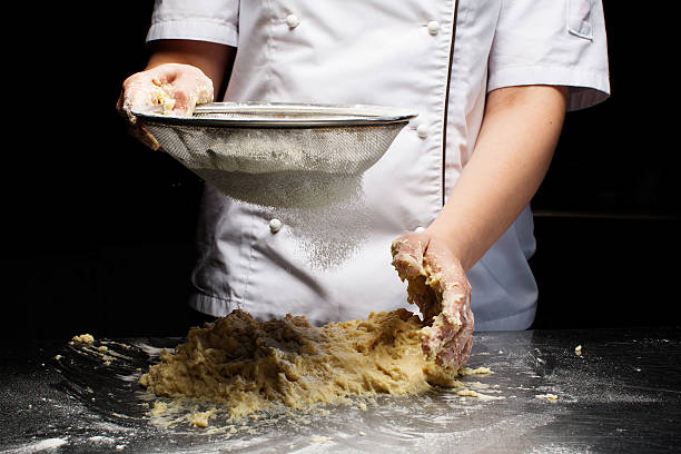 istock Woman hands kneading dough. 603862404