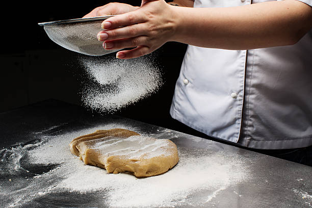 istock Woman hands kneading dough. 603862496