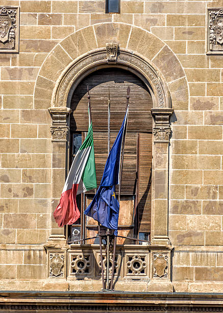 istock Three flags outside a building in Florence, Italy 603863074