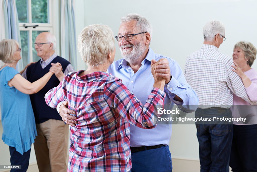 Group Of Seniors Enjoying Dancing Club Together Ballroom Dancing Stock Photo